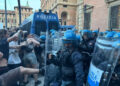 Lancio di bomba carta da manifestanti e carica della Polizia a Bologna